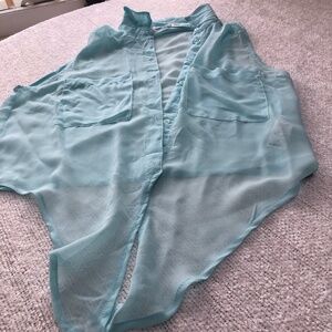 Garage medium size sheer crop top, buttons, and tie, good with shorts, skirt